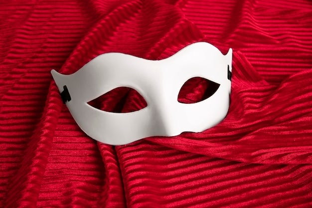 Theater mask on red curtain