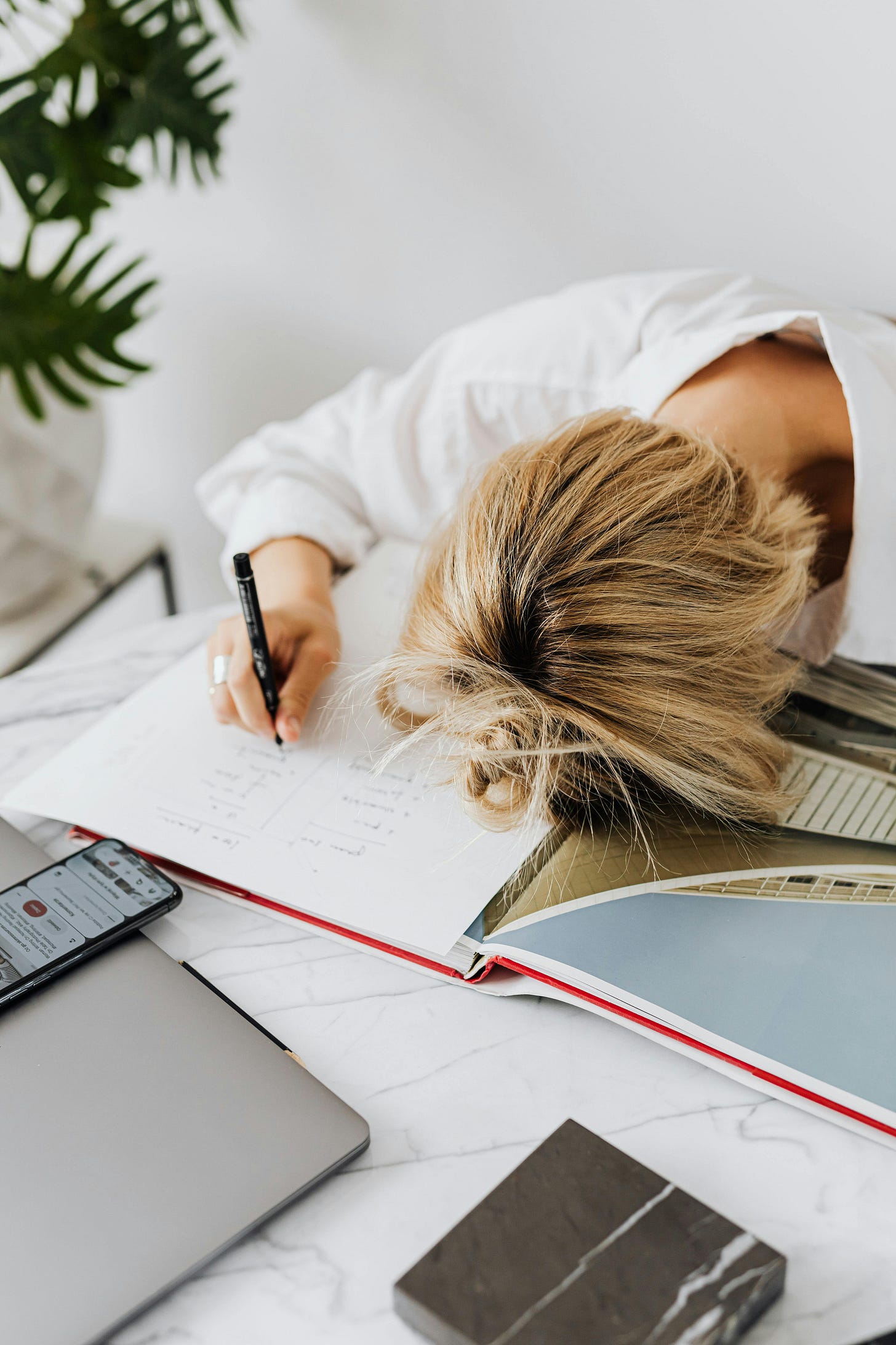 A frustrated woman in a white long sleeve shirt A frustrated woman in a white long sleeve shirt