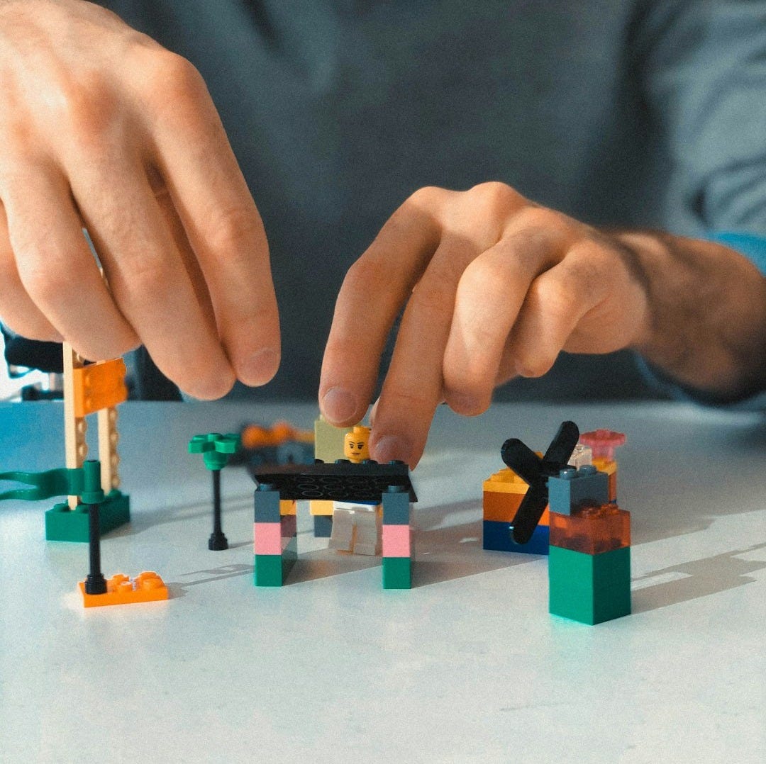 a man building a building blocks