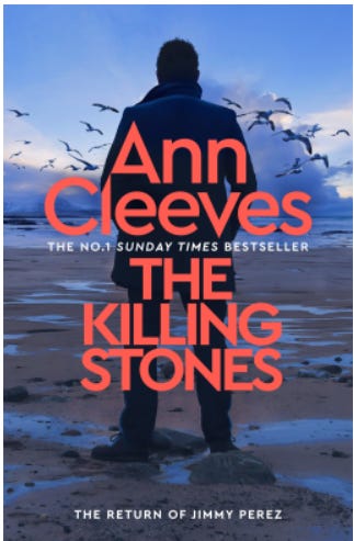 Book cover of The Killing Stones by Ann Cleeves - the return of Jimmy Perez. Image shows a man stood on a deserted beach with birds flying above him.