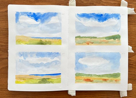 Watercolour landscapes in a sketchbook