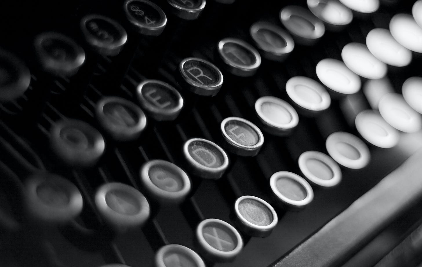 black and white photo of a typewriter keyboard black and white photo of a typewriter keyboard