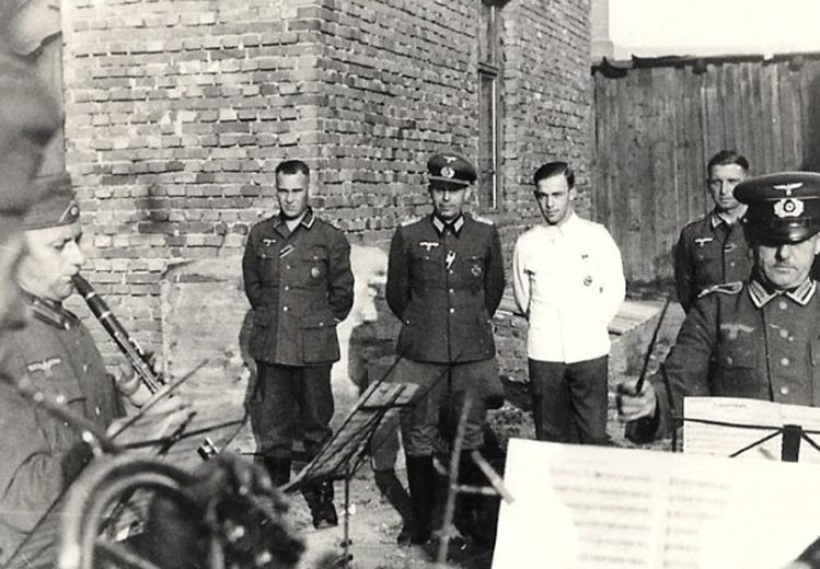 A group of men in uniform standing outside

AI-generated content may be incorrect.
