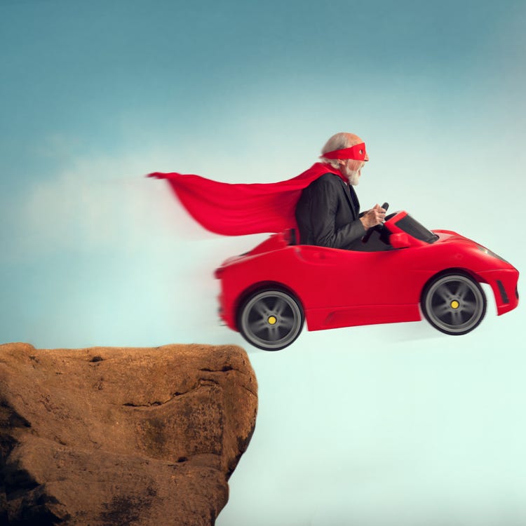 Guy in toy car driving off cliff to illustrate tension in a story.