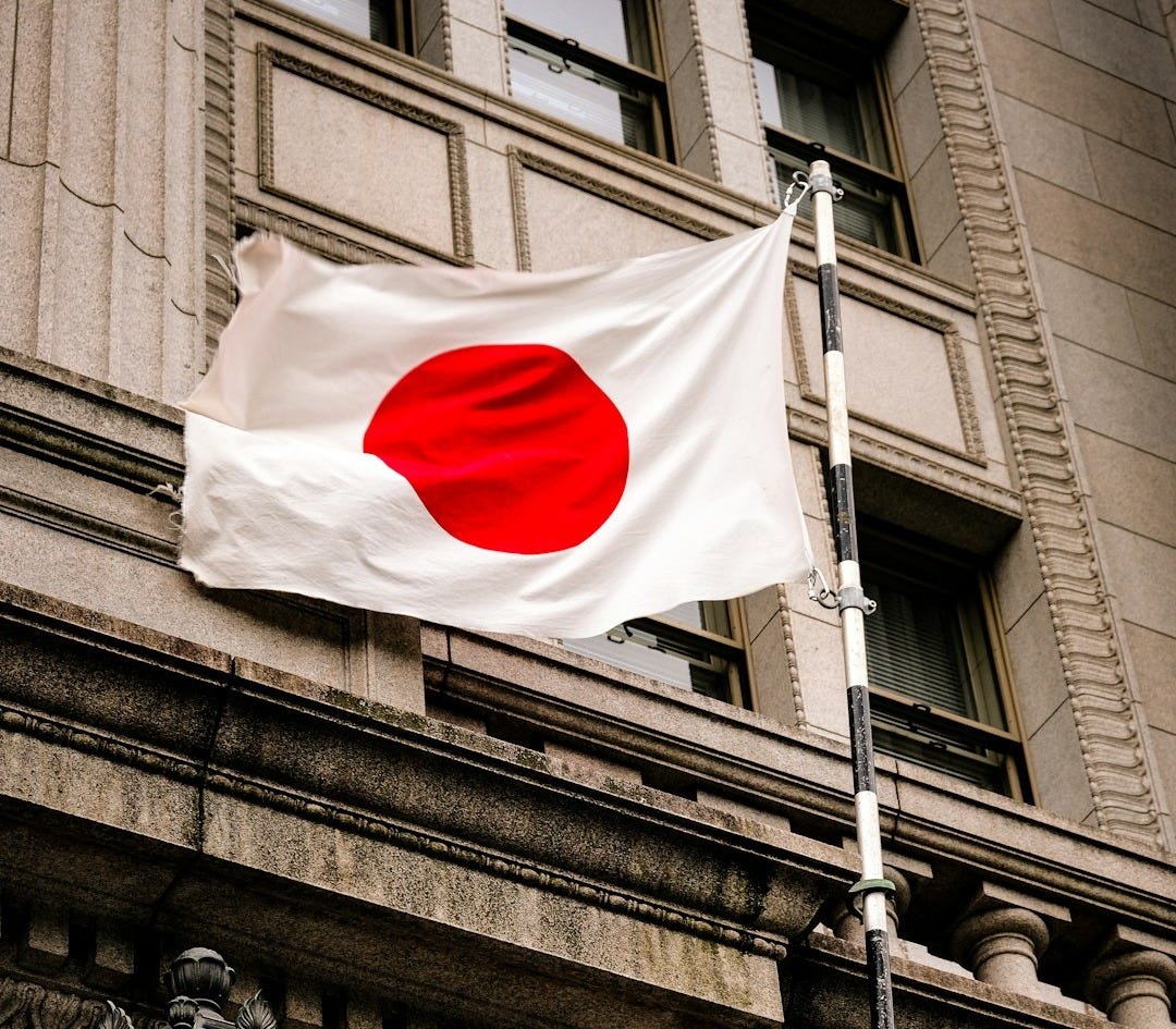 a flag flying in front of a building