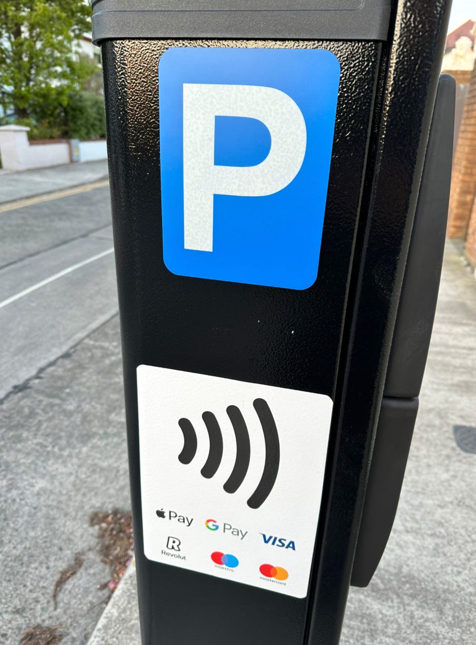 A picture containing outdoor, text, sign, meter

Description automatically generated