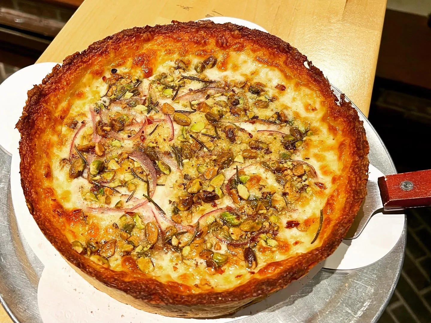 The Rosa Pizza with red onion, rosemary and pistachios The Rosa Pizza with red onion, rosemary and pistachios