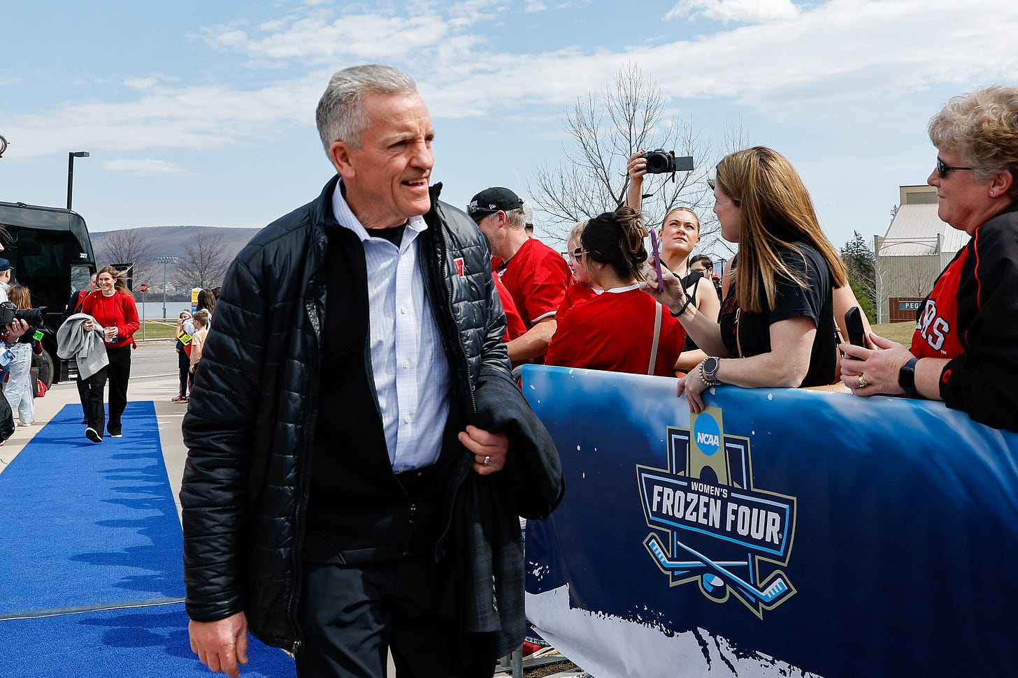 Wisconsin Badgers head coach Mark Johnson in a jacket 