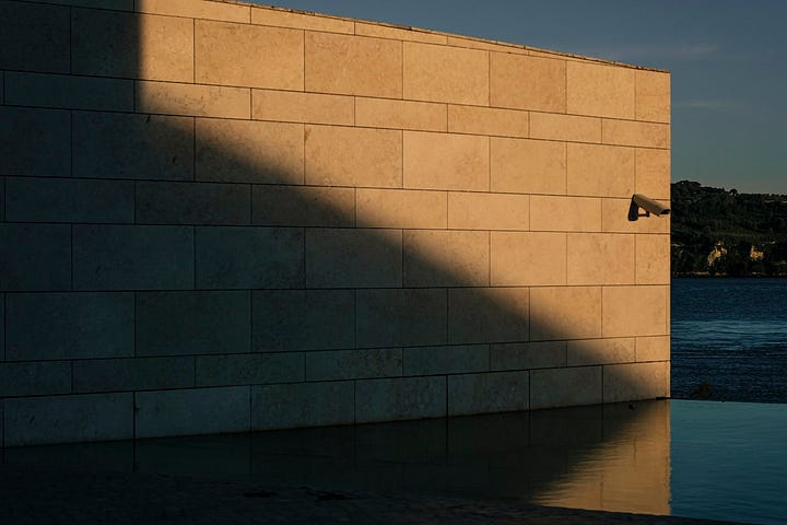 Diagonal lines on façades of various urban structures, in Lisbon.