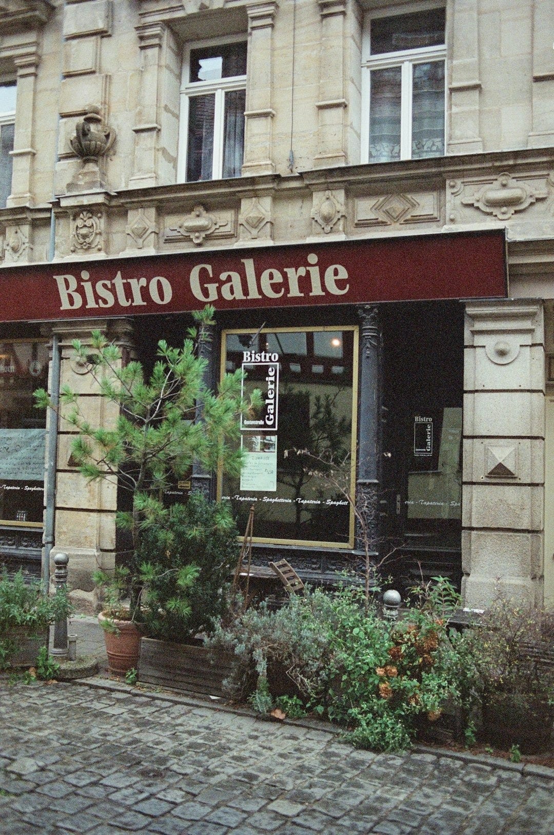a building with a sign that says bistro galerie a building with a sign that says bistro galerie