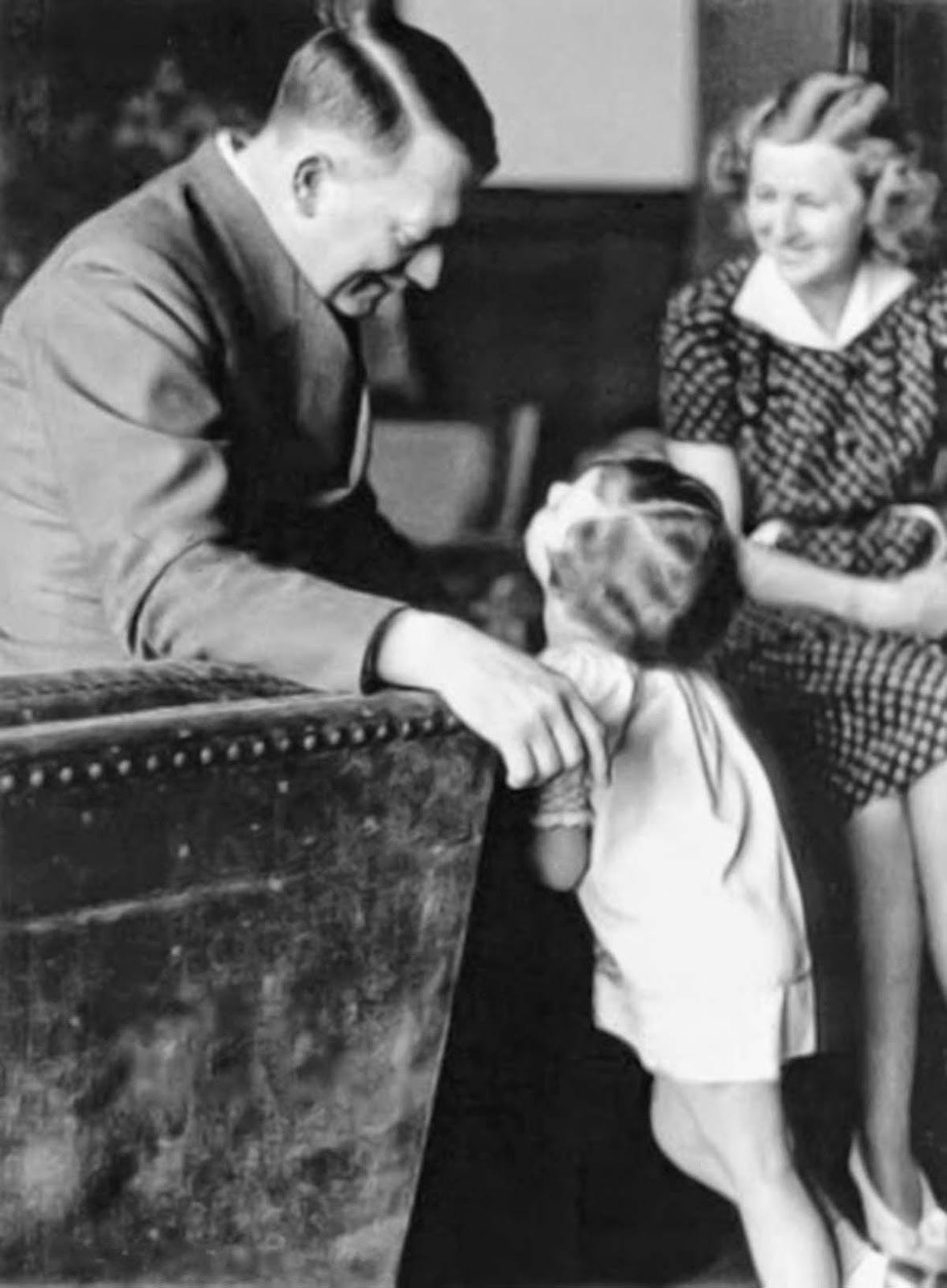 Adolf Hitler and Eva Braun pictured with Ursula “Uschi” Schneider. Adolf Hitler and Eva Braun pictured with Ursula “Uschi” Schneider.