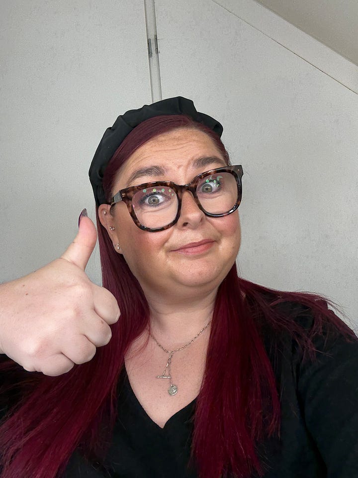 Selfie of Kelly with hair and makeup done ready for work and a bowl with falafel, humous and couc cous for lunch.