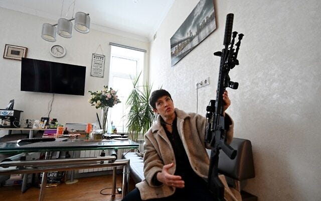 Mariana Zhaglo, mother-of-three, holds her Ukrainian Z-15 - Zbroyar rifle during an interview in the kitchen of her apartment in Kyiv, on January 28, 2022. (Sergei Supinsky/AFP) Mariana Zhaglo, mother-of-three, holds her Ukrainian Z-15 - Zbroyar rifle during an interview in the kitchen of her apartment in Kyiv, on January 28, 2022. (Sergei Supinsky/AFP)