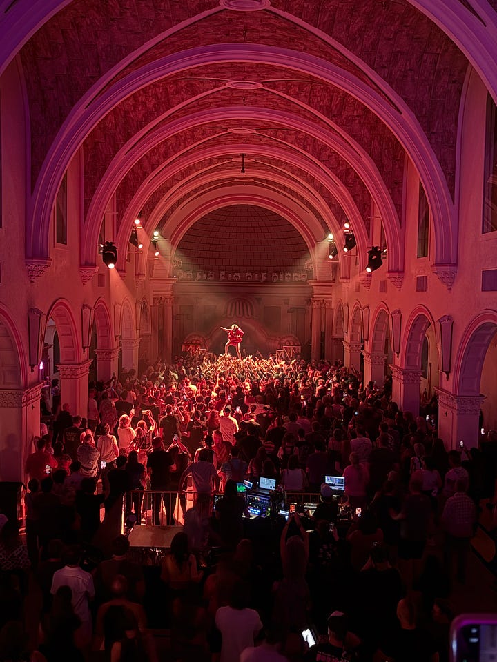 a crowd holding up a woman at La Rosa in Tucson