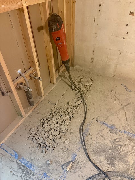 Photo mosaic of concrete being broken up with a jackhammer.