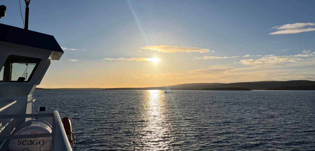 Taken from the Thorsvoe ferry on Scapa Flow, the sun is low in the sky and reflecting off the water. 