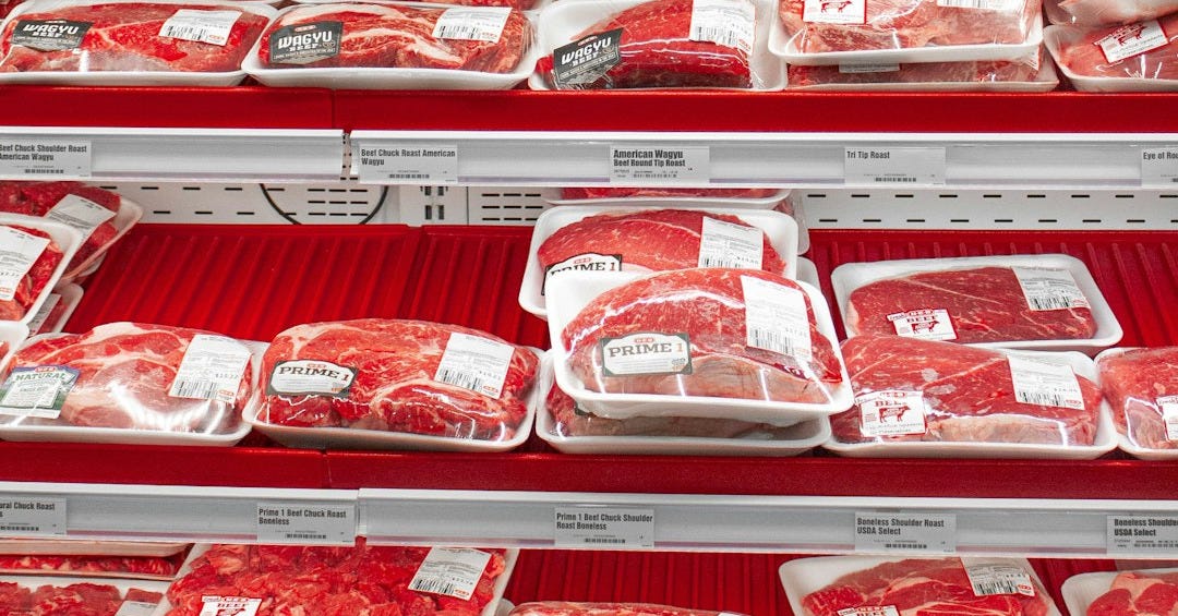 A display in a store filled with lots of meat A display in a store filled with lots of meat