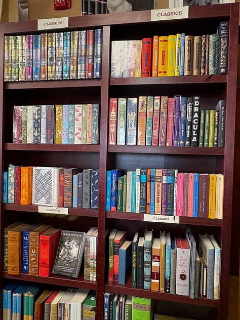 Bookshelves filled with colorful books, labeled "Classics"