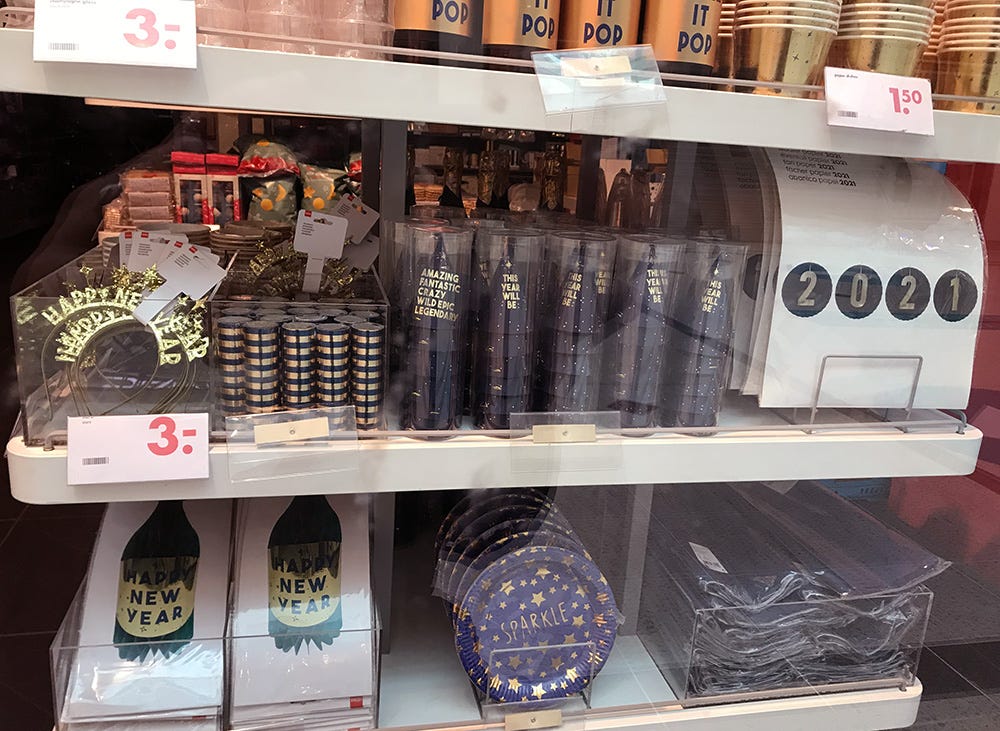 Christmas and new year products on a shelf in a shop window