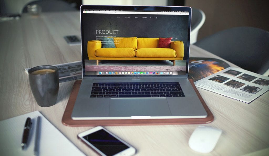 an open computer with a window open of an online furniture shop