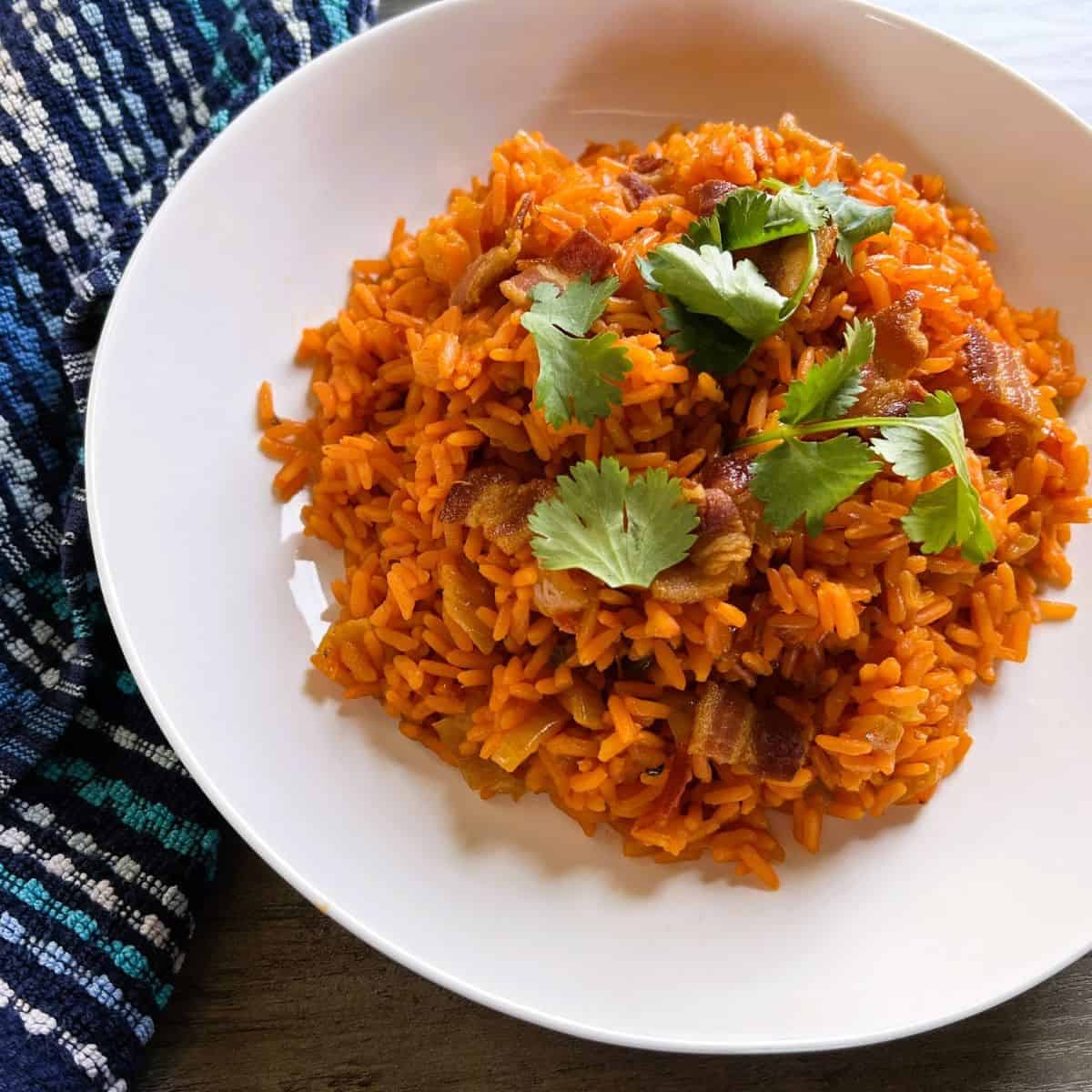 Finished Mexican Rice Made Simple with Salsa in a white bowl garnished with cilantro