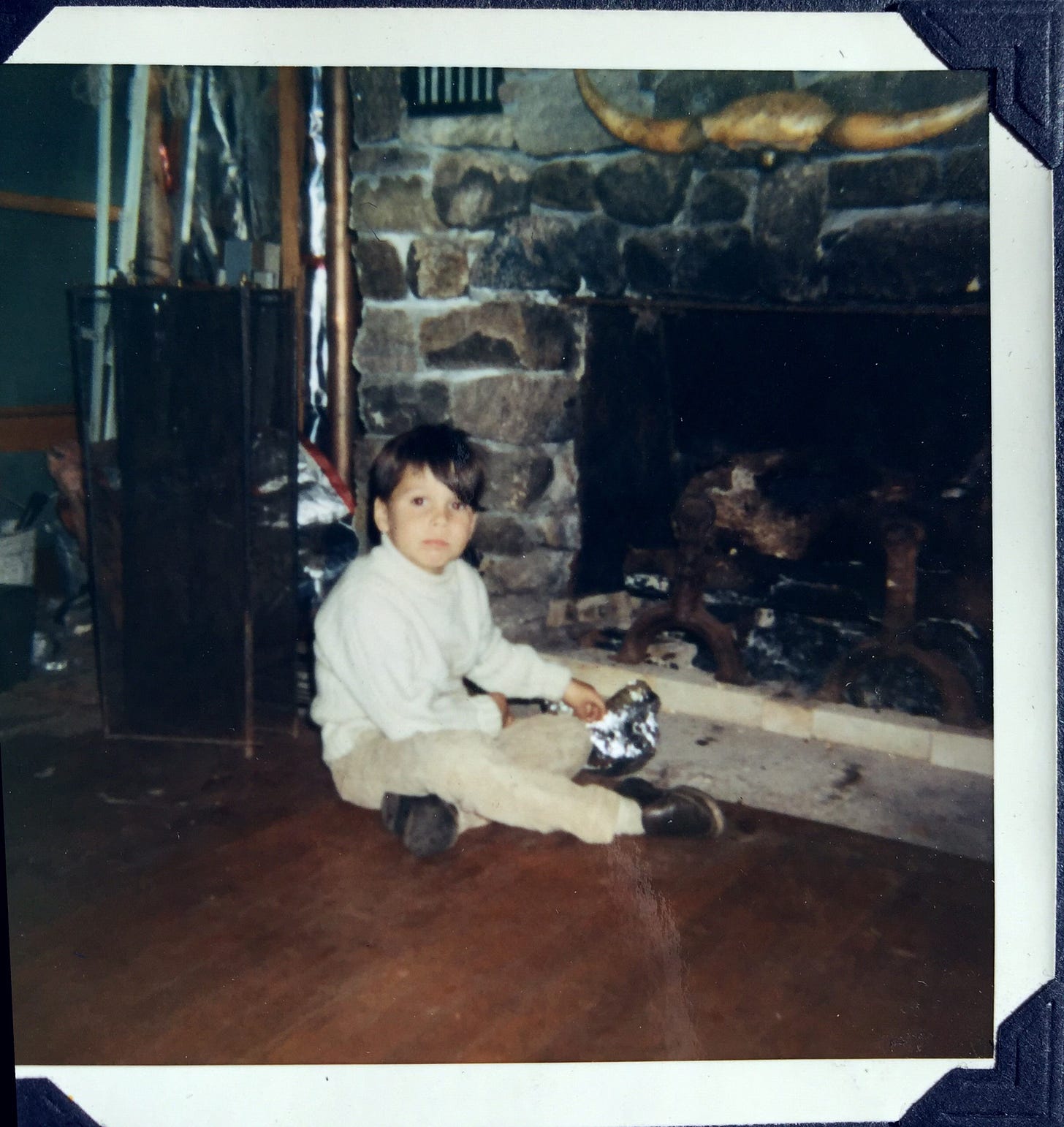 Me, sitting in front of the fireplace, watching TV and eating Jiffy Pop. Upstate New York, circa 1972.