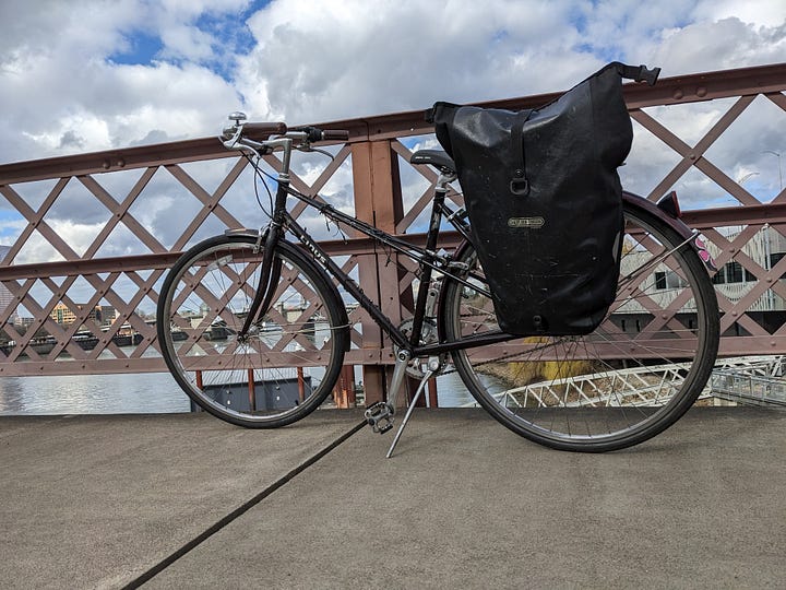 bicycle on the Hawthorne bridge, and a farmers market early Spring shopping trip goods