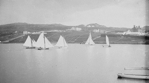 An early photo of the Regatta showing sailboats on the lake An early photo of the Regatta showing sailboats on the lake
