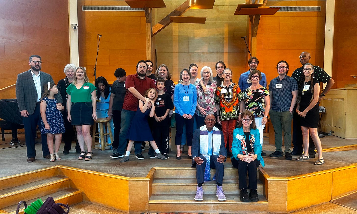 new members pose for a group photo in the sanctuary.