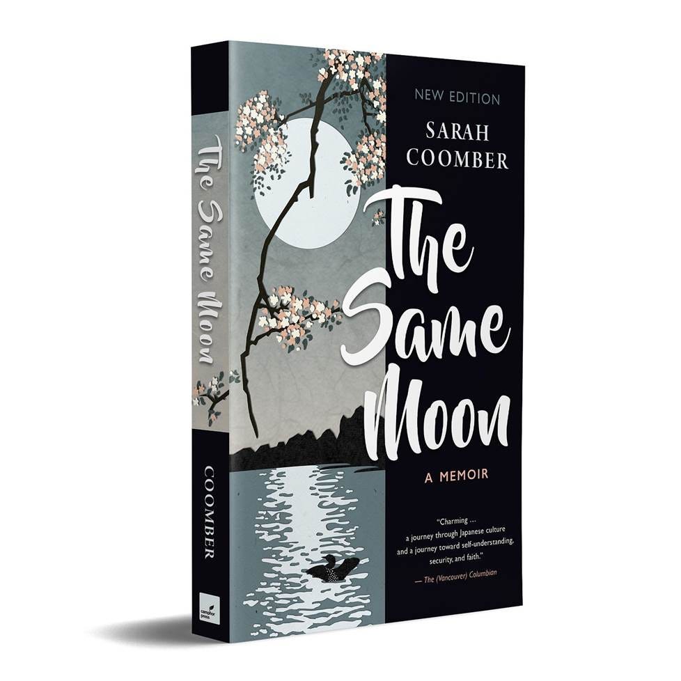 Book cover for The Same Moon, featuring a branch of plum blossoms in front of a full moon shining down on a lake where a loon stretches its wings