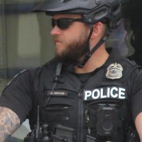 Cop ran red light, stop signs during unauthorized pursuit