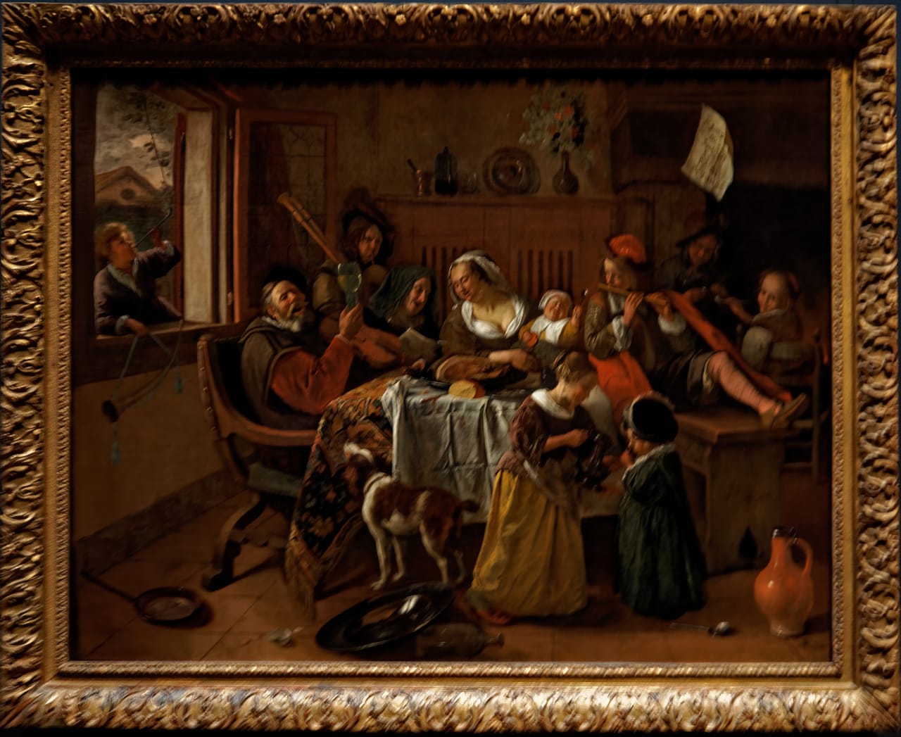 A family singing and pouring wine around a laden table