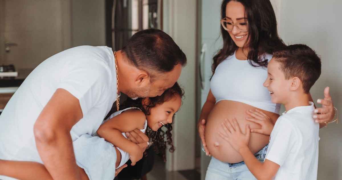 Happy family with pregnant mother