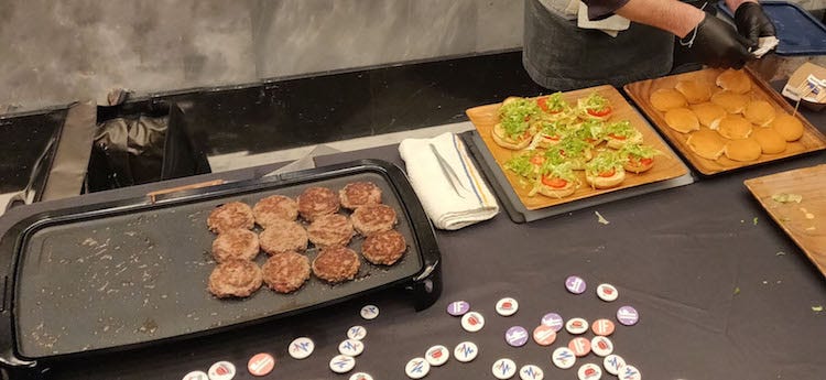 Impossible Burgers being cooked on a grill