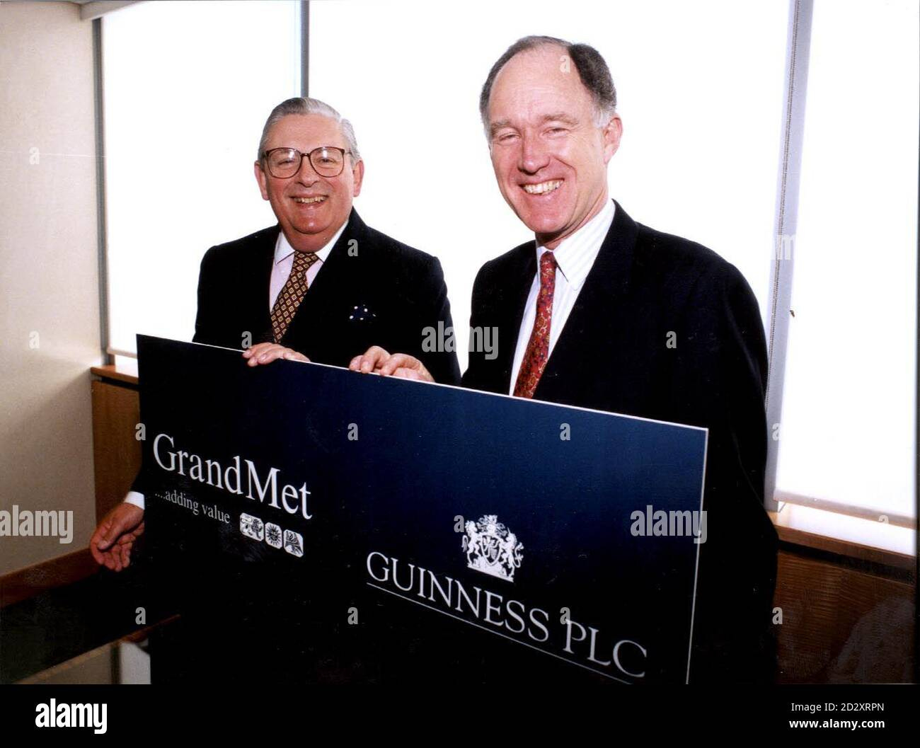 George Bull, Chairman, Grand Metropolitan PLC (left) and Tony Greener,  Chairman Guinness PLC. Drinks giants Guinness and Grand Metropolitan today  (Monday) announced plans for a proposed multi-billion pound merger. See PA  Story