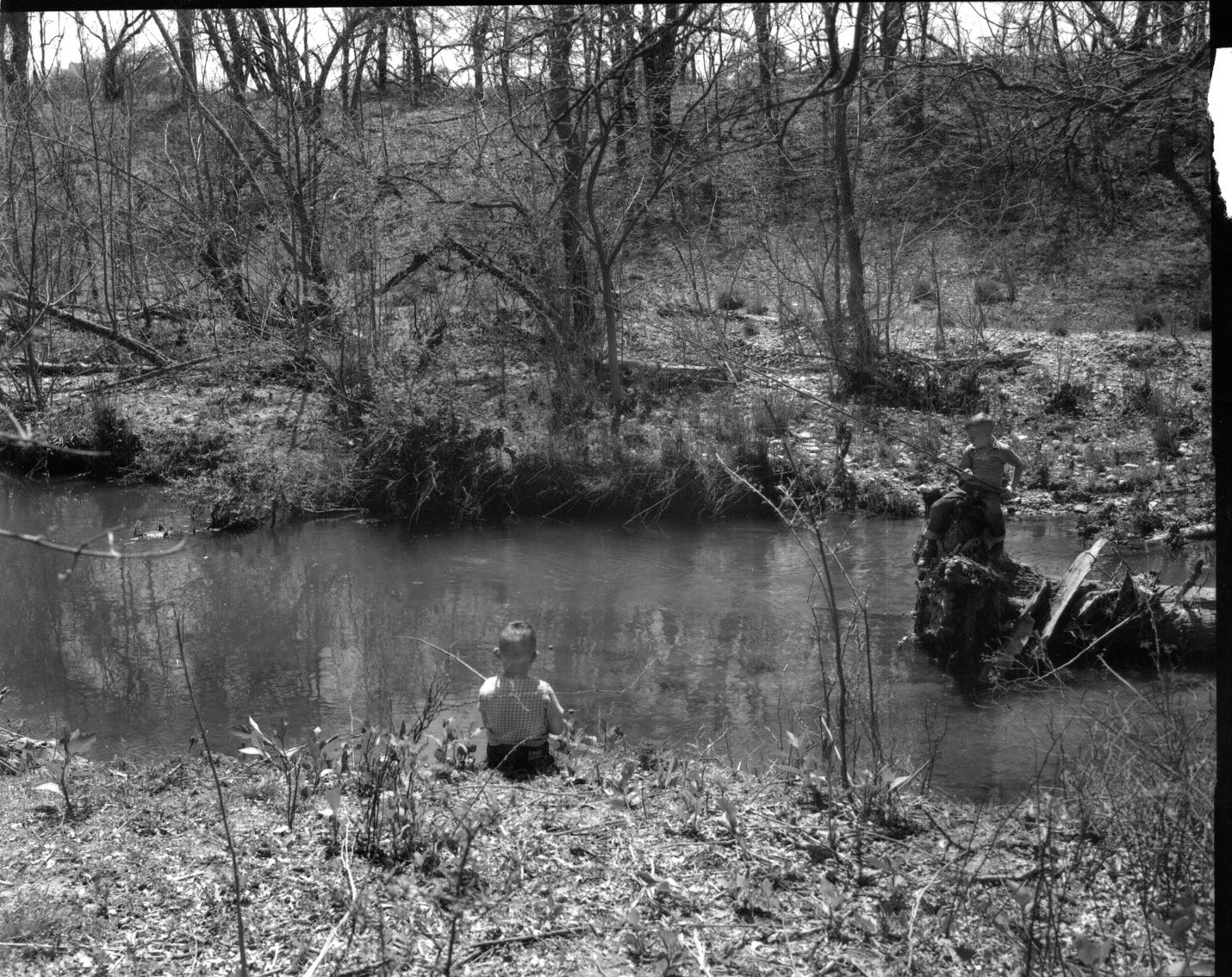 A group of children fishing in a river

AI-generated content may be incorrect.