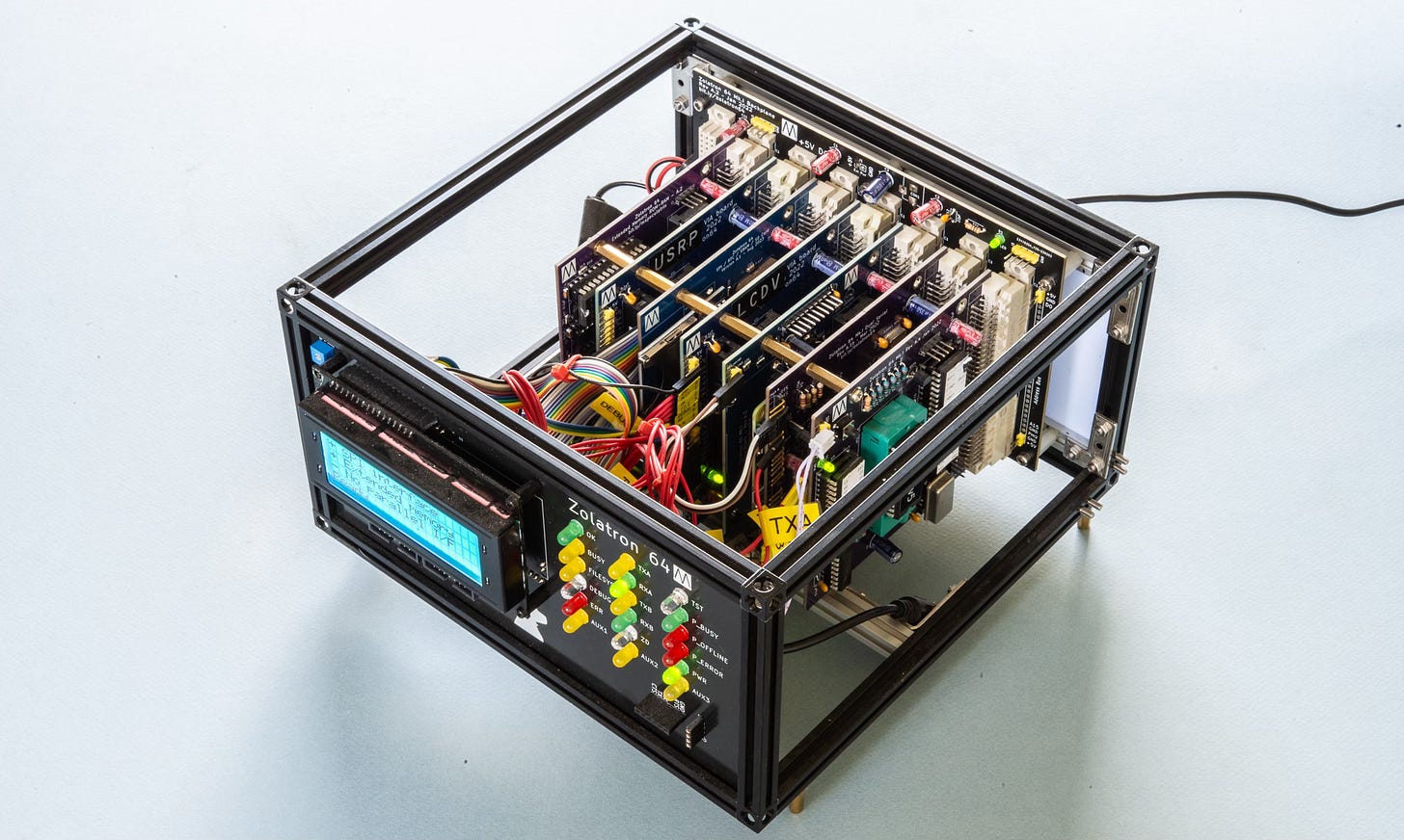 Photograph of a homebrew computer showing multiple module boards plugged into a backplane.