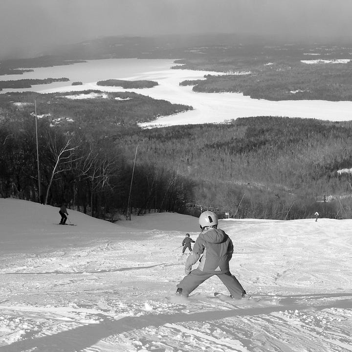 Diptych. Black and white images - child skiing on a trail; grandfather with a child on either side on a ski hill.