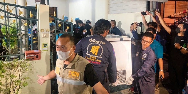 Thailand police carry freezer