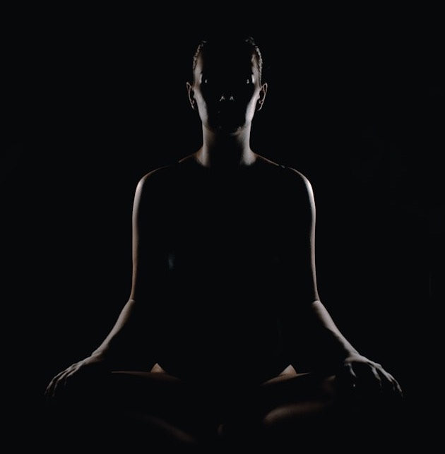 person doing meditation pose