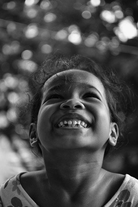 Images of people at different ages smiling