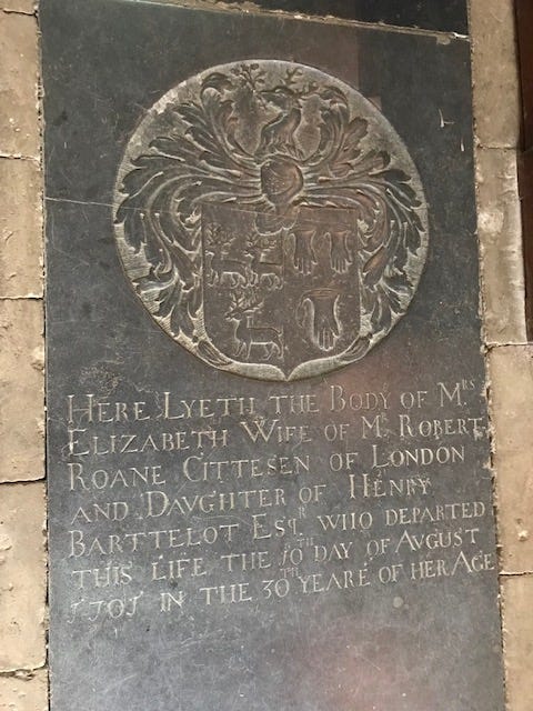1707 crypt with a family crest or coat of arms