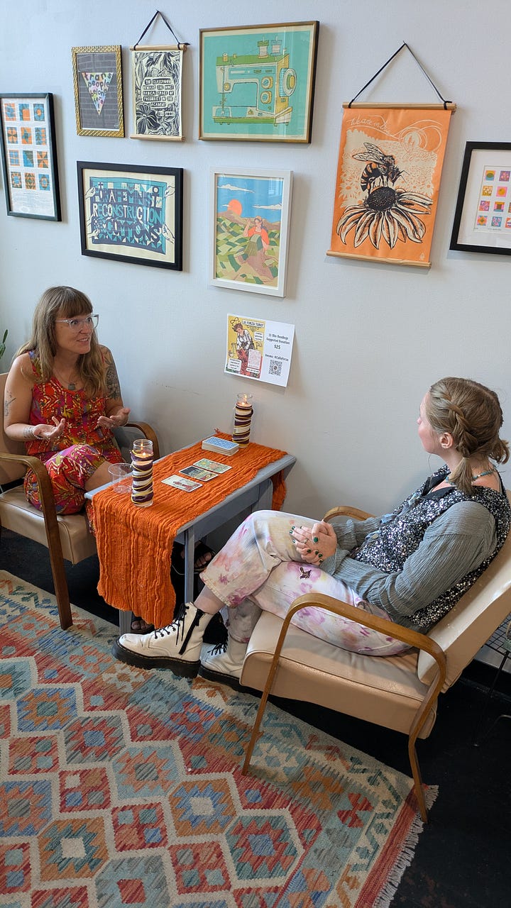 studio scenes, the class listing board and two people doing a tarot reading at an event