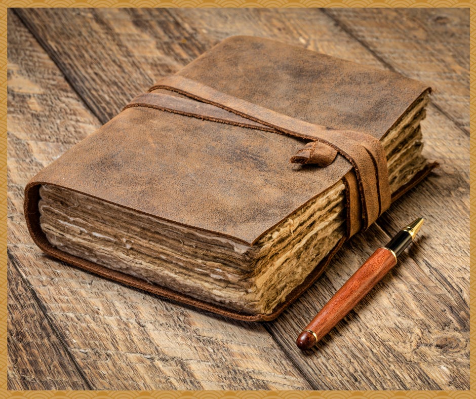 A bound old leather journal on old wood table next to a pen