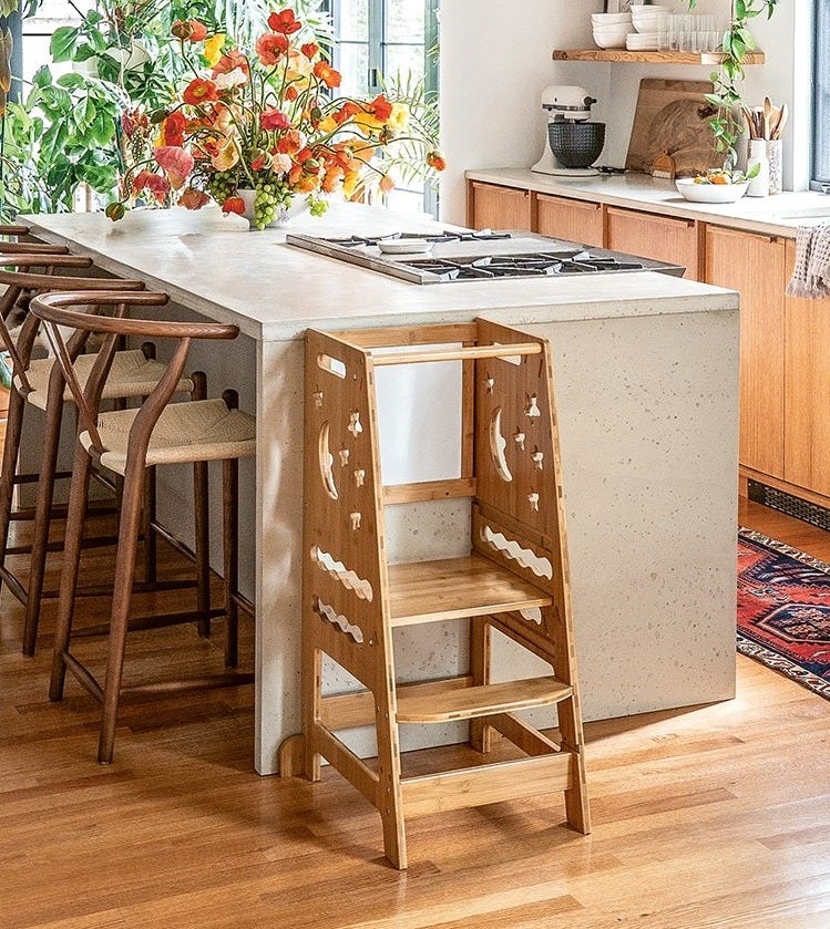 Stone kitchen island and wood cabinets