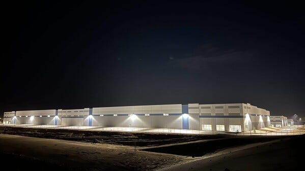 A massive 826,780-square-foot warehouse sits illuminated Feb. 12, 2026, in the El Paso suburb of Socorro, Texas, that was recently purchased by the U.S. Department of Homeland Security for $122.8 million. (ASP Photo/Morgan Lee)