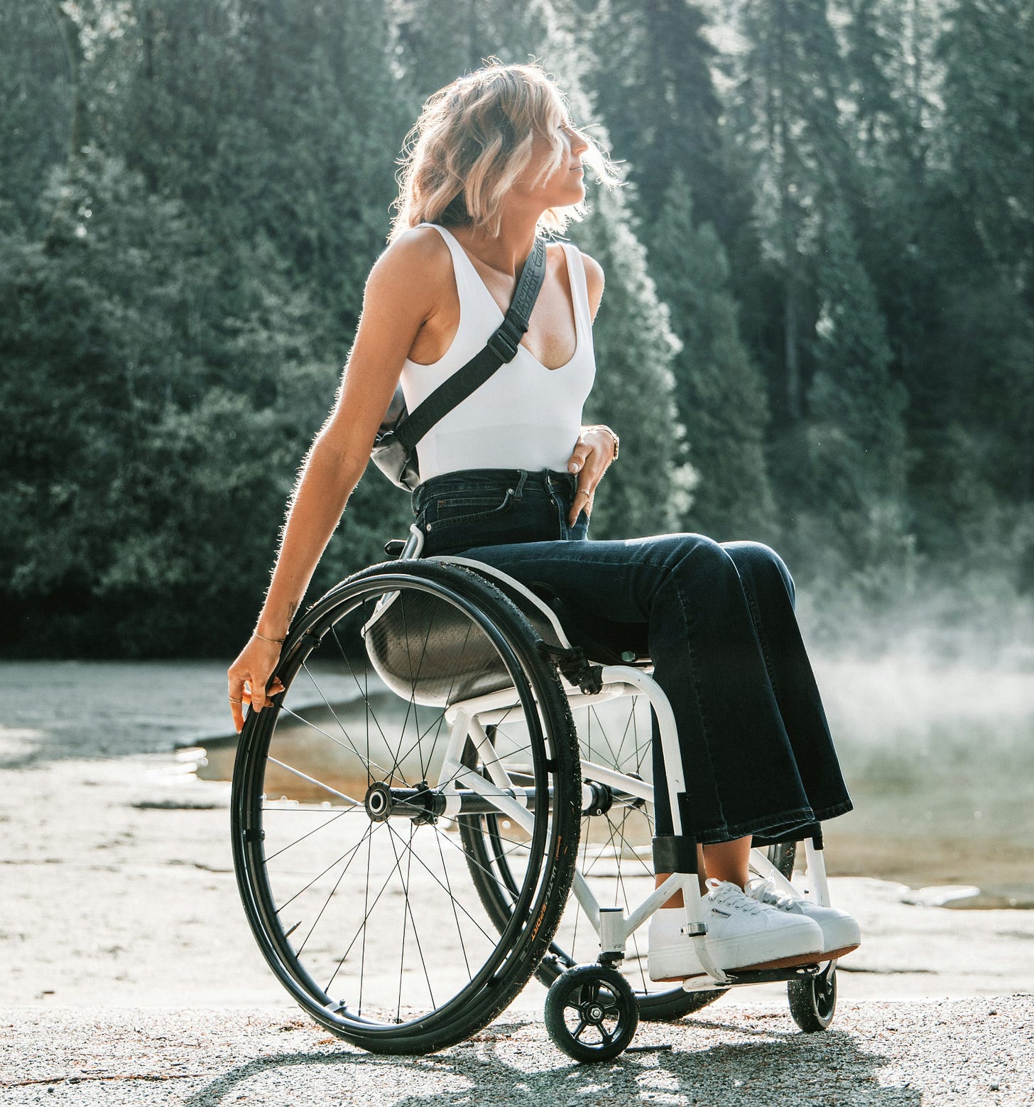 woman riding wheelchair near trees