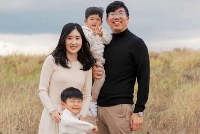 A group of people posing for a picture

Description automatically generated