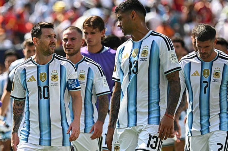 Argentina's forward #10 Lionel Messi speaks with Argentina's defender #13 Cristian Romero during halftime of the 2026 World Cup football tournament final match between Spain and Argentina at the New York/New Jersey Stadium in East Rutherford on July 19, 2026. (Photo by Paul ELLIS / AFP via Getty Images) Argentina's forward #10 Lionel Messi speaks with Argentina's defender #13 Cristian Romero during halftime of the 2026 World Cup football tournament final match between Spain and Argentina at the New York/New Jersey Stadium in East Rutherford on July 19, 2026. (Photo by Paul ELLIS / AFP via Getty Images)