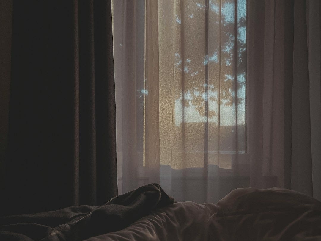 white and brown window curtain